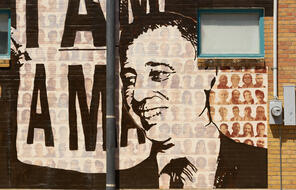 A black and white painting of Rabbi James A. Wax on the Memphis Upstanders Mural, a painting on a brick wall in Memphis, TN.