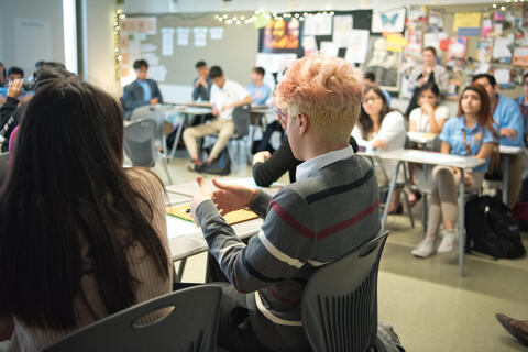 Student-led teaching session takes places in a classroom.