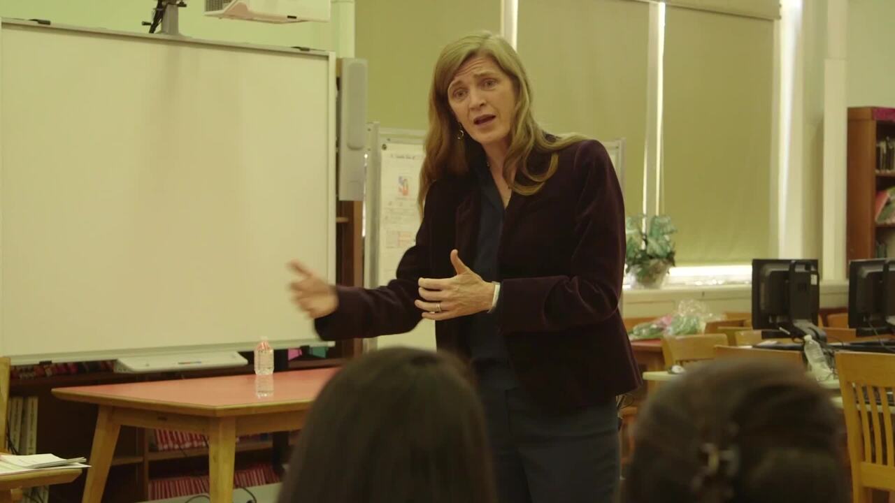 Ambassador Samantha Power talks in front of a group of students.
