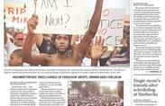 Newspaper front page featuring story about protests and police in Ferguson.