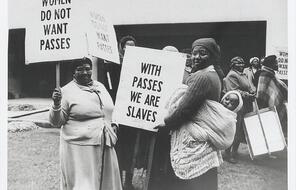 A group of women hold signs in demonstration against the pass laws in Cape Town on August 9, 1956, the same day as the massive women’s protest in Pretoria.