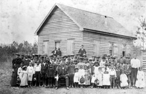 Professor Jacob's School, African-American, students and teacher in front of school, early 1900's.