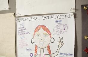 A drawing of a girl with her name Serena Bialkin at the top and characteristics written around her
