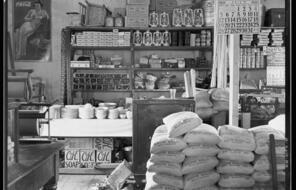 An old country store contains sacks of food and other items for purchase.