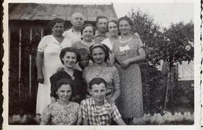 Family portrait with children, parents, and grandparents. Taken circa 1930-1940.