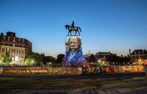  The image of late Rep. John Lewis, a pioneer of the civil rights movement and long-time member of the U.S. House of Representatives, is projected on the statue of Confederate General Robert E. Lee in Richmond, Virginia, U.S.