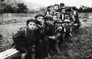 Young boys on a bench in Sighet, Poland. Circa 1920.