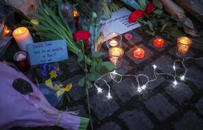 Flowers and candles are seen at a memorial site in Clapham Common Bandstand, following the kidnap and murder of Sarah Everard, in London, Britain March 13, 2021.