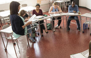 An educator walks through instructions for a teaching strategy procedure with students.