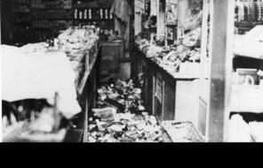Torn apart shelves and damage in the department store Uhlfelder in Munich during Kristallnacht.