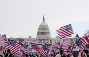  Picture of U.S. Capitol With American Flags Waving In The Foreground.