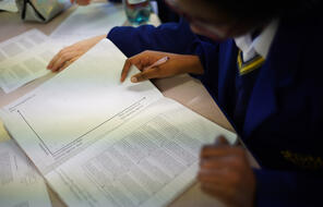 Photograph of student working on worksheet