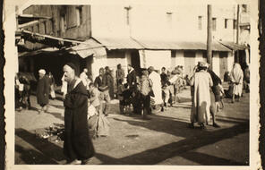 A group of people walk down a street in Casablanca.