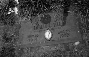 A black and white image of the grave site of Emmet Till lies submerged in melting frost at the Burr Oak cemetery on March 5, 2012 on the outskirts of Chicago, Illinois