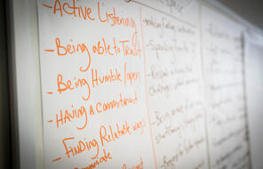 Whiteboard with aspirations for upcoming session, including "Active Listening", "Being able to Trust", "Being Humble/Open", "Having a Commitment", and "Finding relatable ways to communicate"