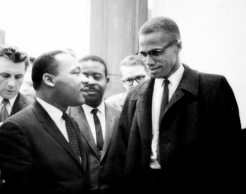 Photo of Martin Luther King and Malcolm X Talking