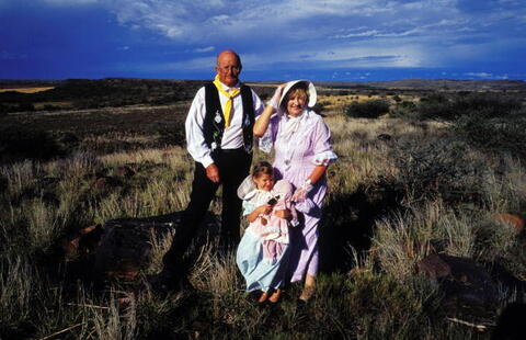A family dressed in traditional Afrikaner clothing pose during a holiday celebration commemorating ‘the Battle of Blood River,’ on December 16, 2003 in Orania, Northern Cape province, South Africa.