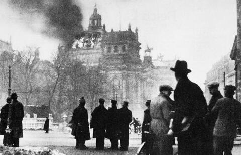  Germans look on as the Reichstag building burns on February 27, 1933.