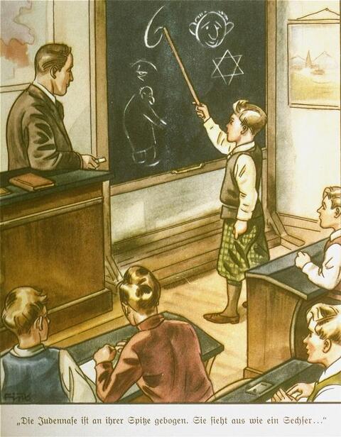 A child in a classroom standing at the chalkboard demonstrating anti-semitic knowledge