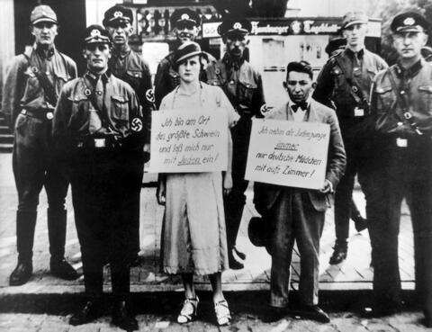 In 1933, Jewish businessman Oskar Danker and his girlfriend, a Christian woman, were forced to carry signs discouraging Jewish-German integration. Intimate relationships between “true Germans” and Jews were outlawed by 1935.