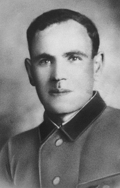 A photo portrait of a young, clean-shaven, white man in uniform 