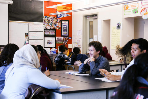 Students engage in classroom discussion. 