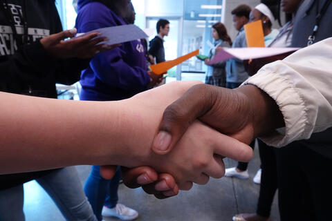 Photograph of a handshake during the Facing History Youth Summit in 2018. 