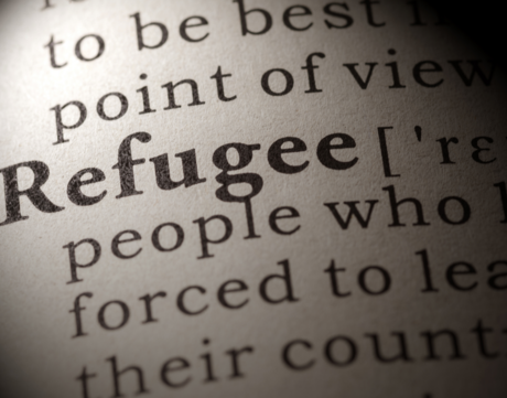 The definition of refugee spotlighted on a page