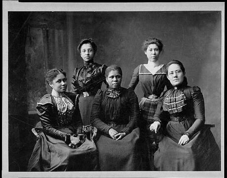 Five black women officers sitting for a portrait
