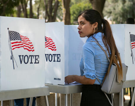 Women at voting booth