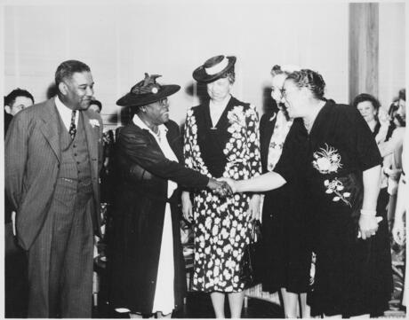 Mary McLeod Bethune, Eleanor Roosevelt, and others at the opening of Midway Hall, one of two residence halls built by the Public Buildings Administration of Federal Works Agency (FWA) for Negro government girls.