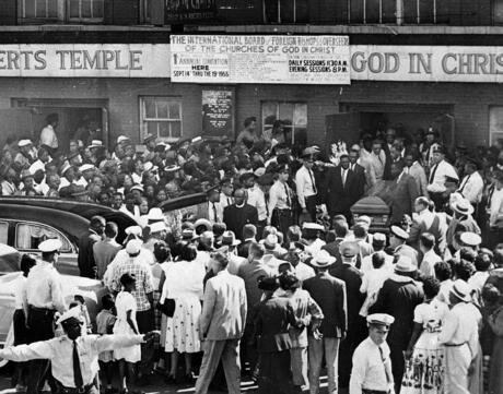 A large crowd gathers outside the Roberts Temple Church of God In Christ in Chicago, Ill., Sept. 6, 1955 as pallbearers carry the casket of Emmett Till, a 14-year-old African-American boy who was slain while on a visit to Mississippi. Police estimate a crowd of about 2,000. 