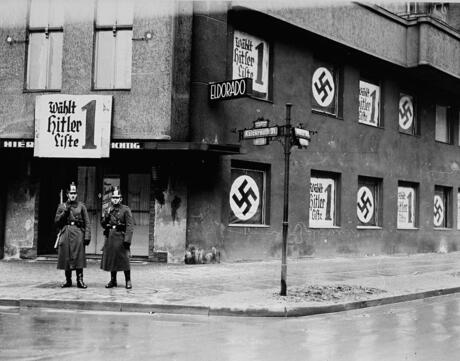 Nazi's standing outside of a building